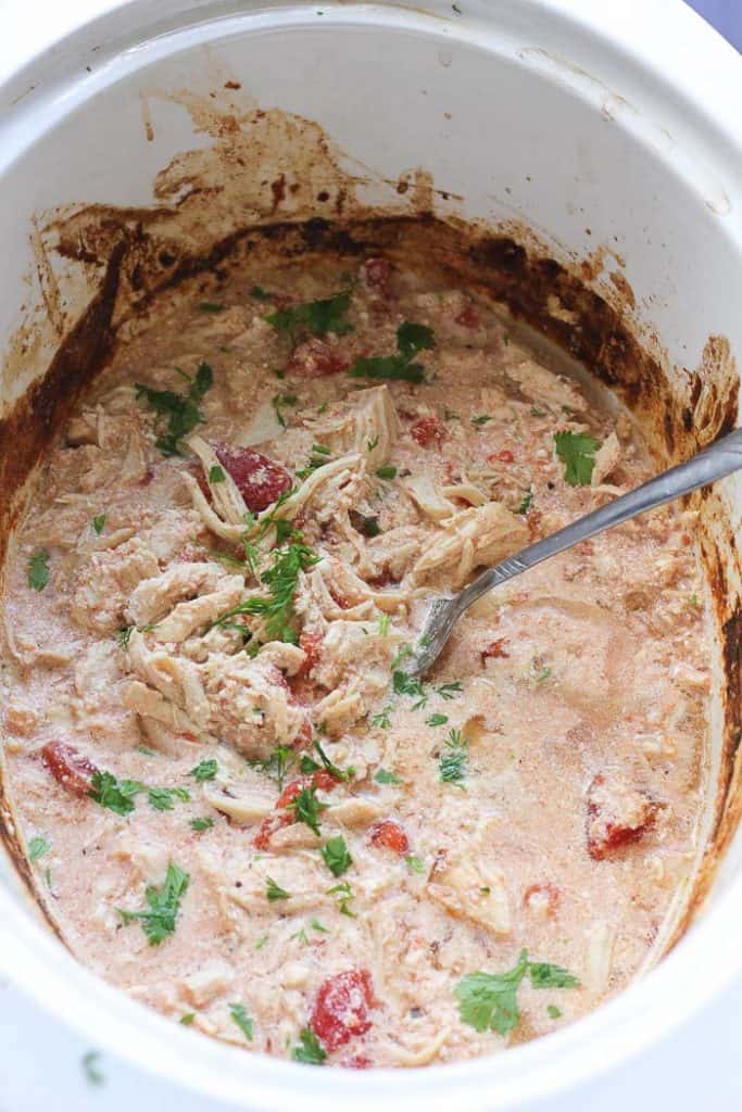 slow cooker pot with shredded chicken