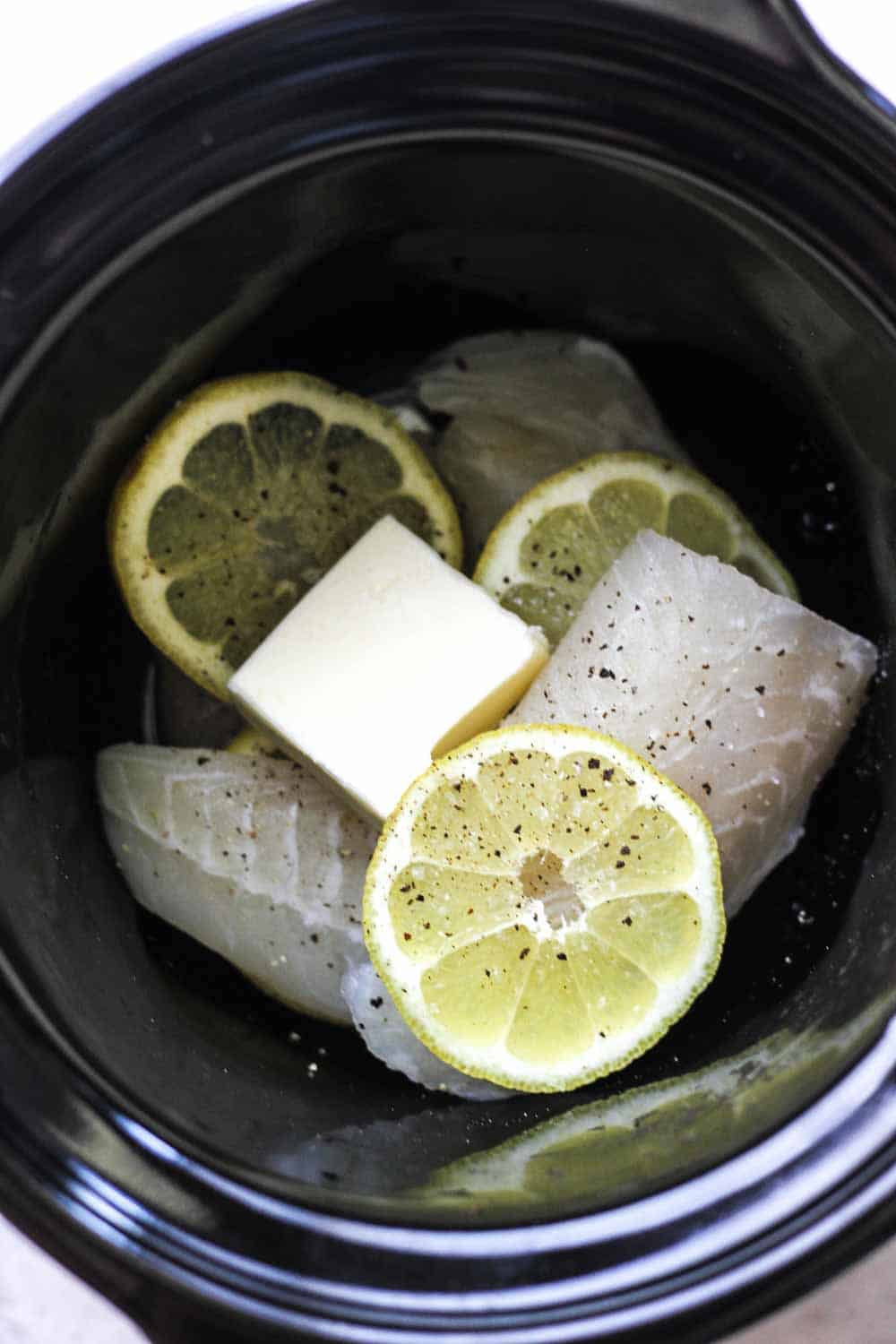 butter and tilapia in slow cooker
