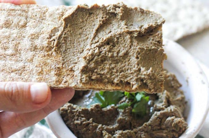 square image of pate on the piece of whole wheat cracker