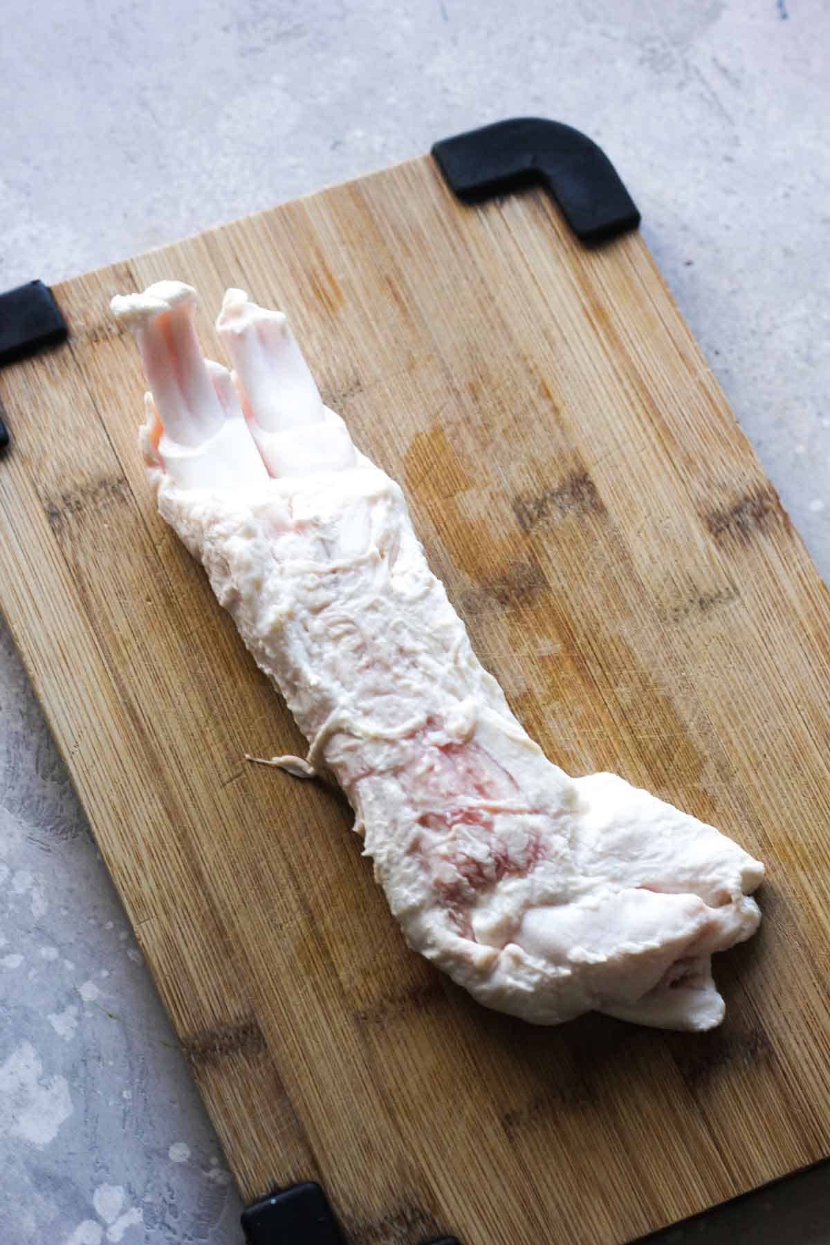 top view of raw beef tendon on the cutting board