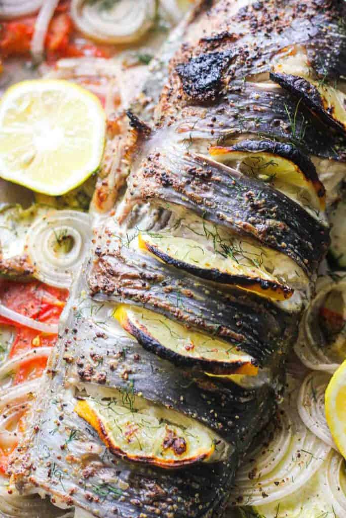 baked whole catfish with lemon slices