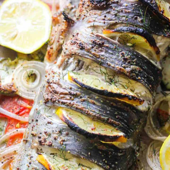 baked whole catfish with lemon slices