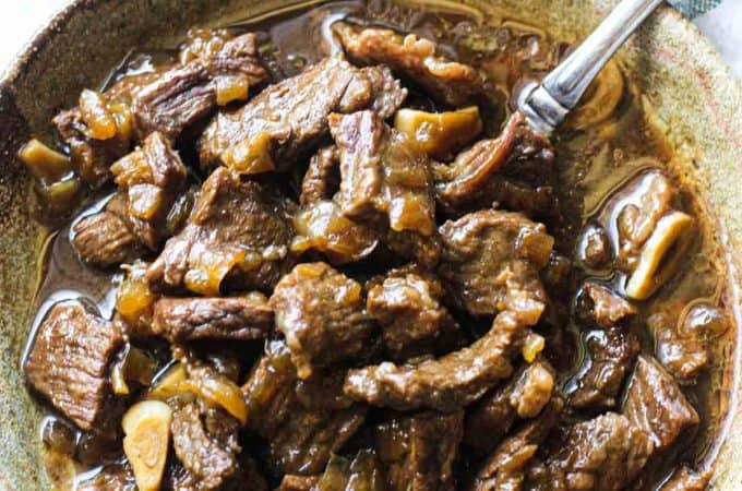 beef tips and onion gravy in the bowl