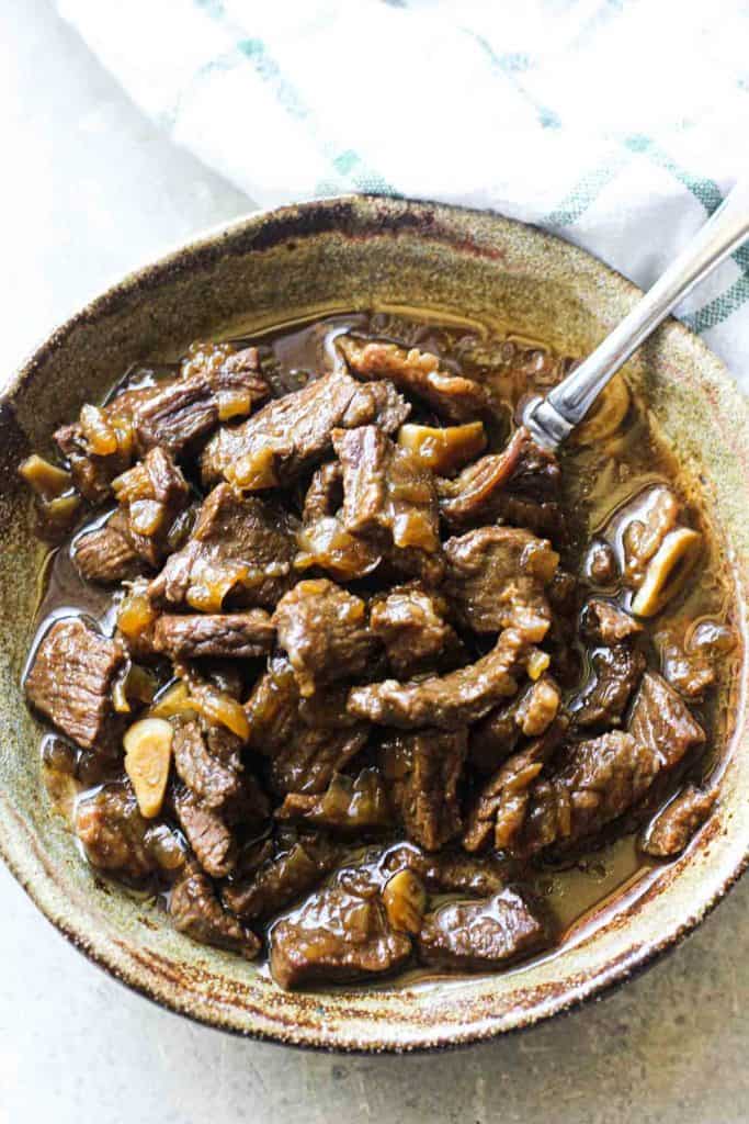 beef tips and onion gravy in the bowl