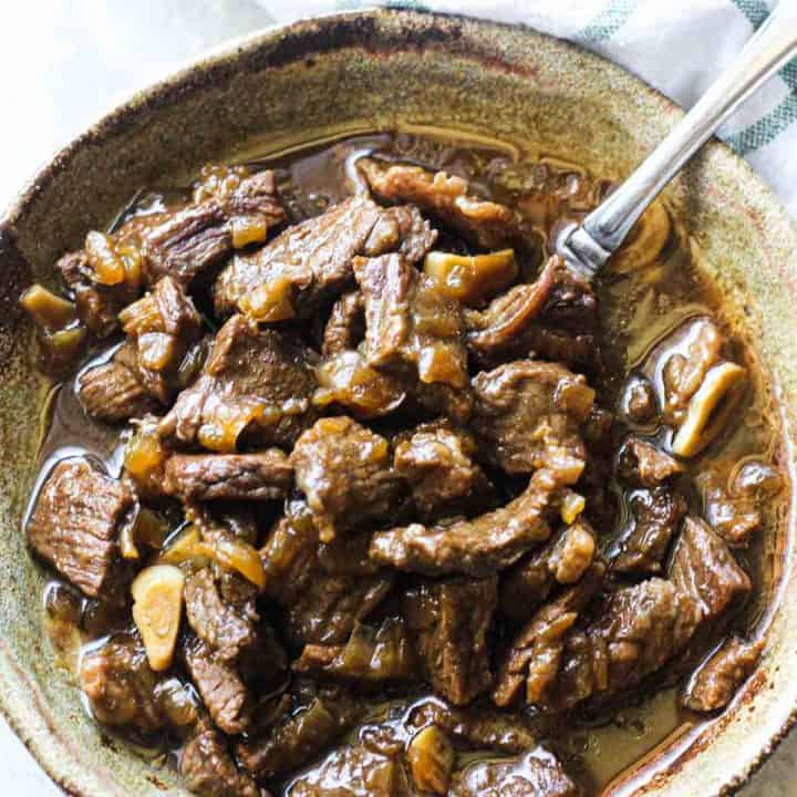 beef tips and onion gravy in the bowl