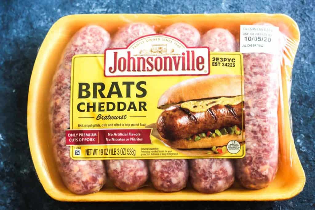 raw brats cheddar bratwurst in the package before cooking in air fryer