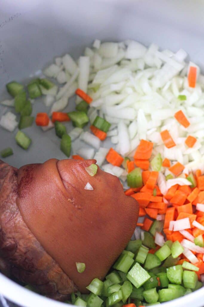 ham hpck and chopped carrots, onions and celery in the pressure cooker pot