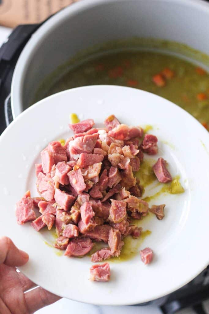 chopped ham from ham hock from soup in the plate