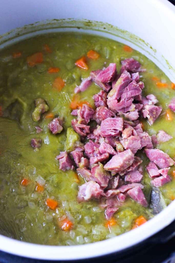 green split pea soup with vegetables and chopped ham