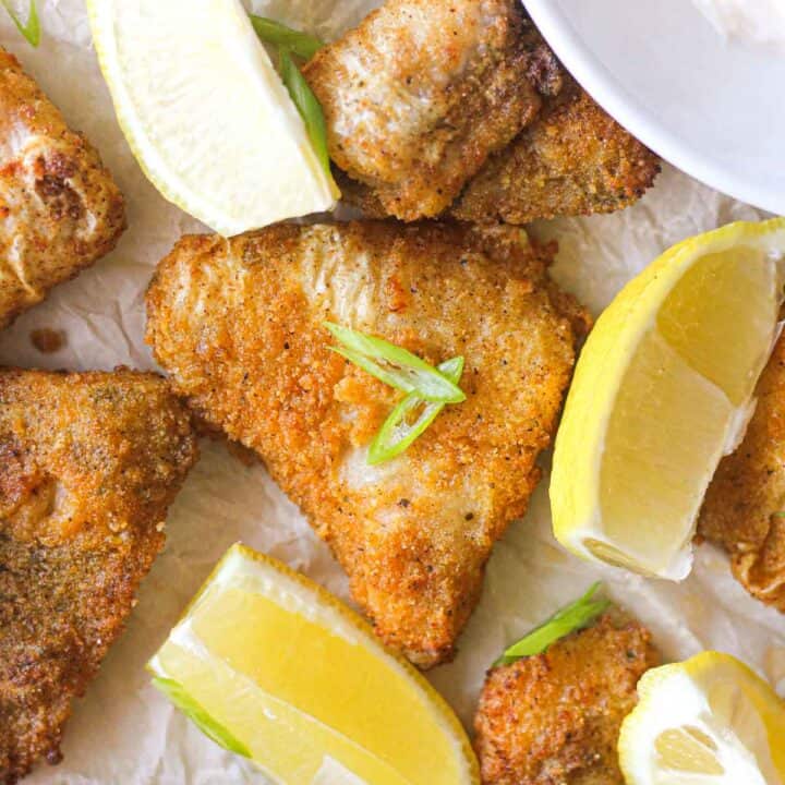 golden colored breaded catfish nuggets with lemon