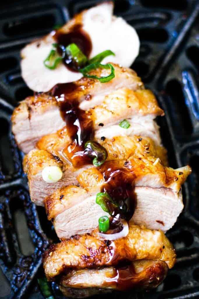 plum souce drizzled on top of cooked duck breast