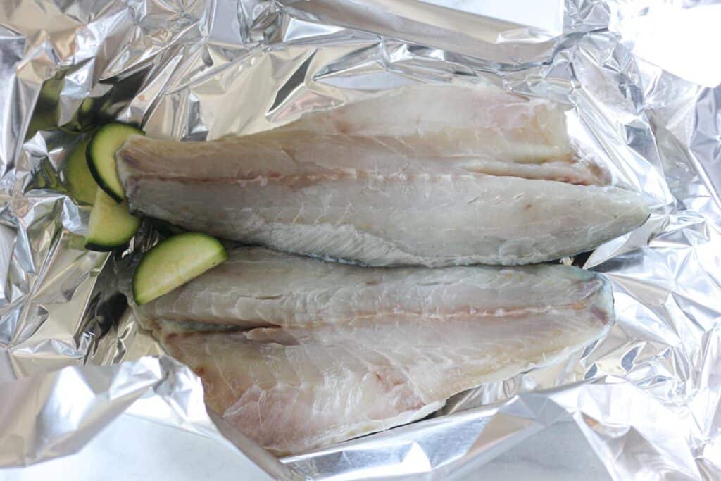 raw europian bass fillets in foil