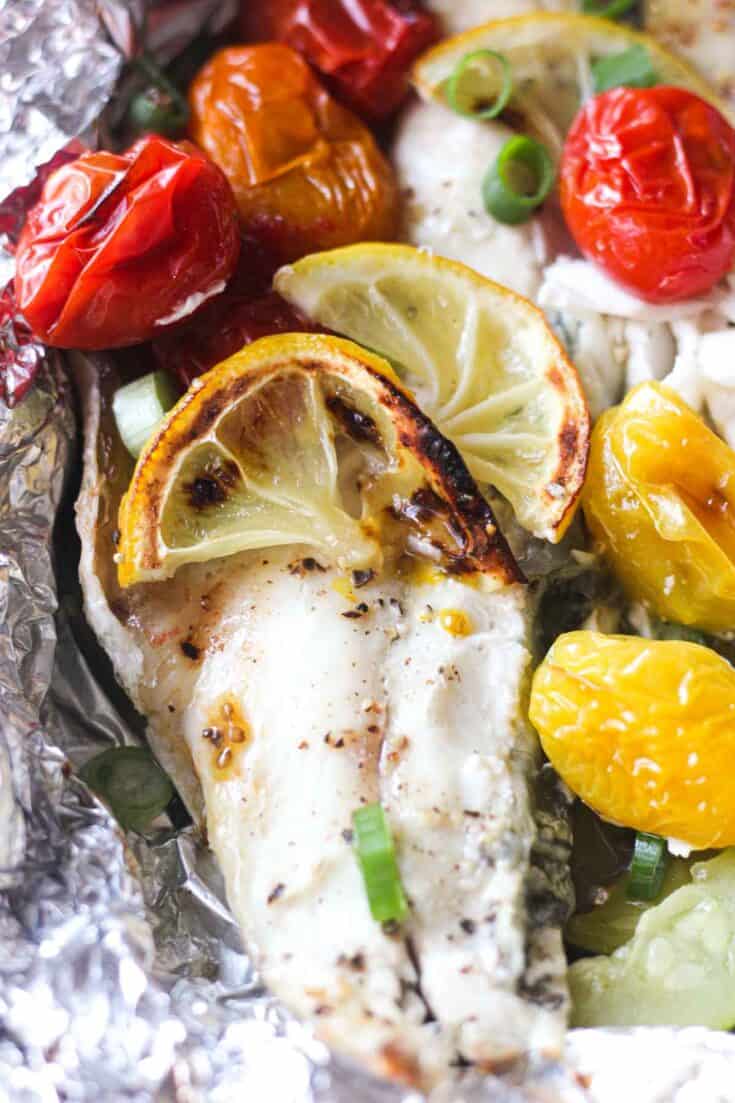 Baked branzino fillets in foil with vegetables - The Top Meal