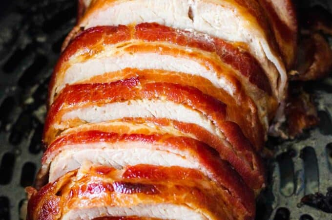 slices of bacon wrapped pork tenderloin in ninja foodi air fryer