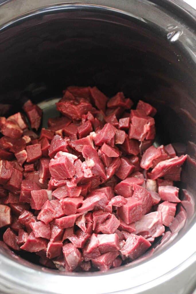 cubed raw beef heart in slow cooker