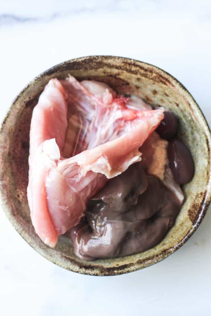 raw rabbit parts in a bowl