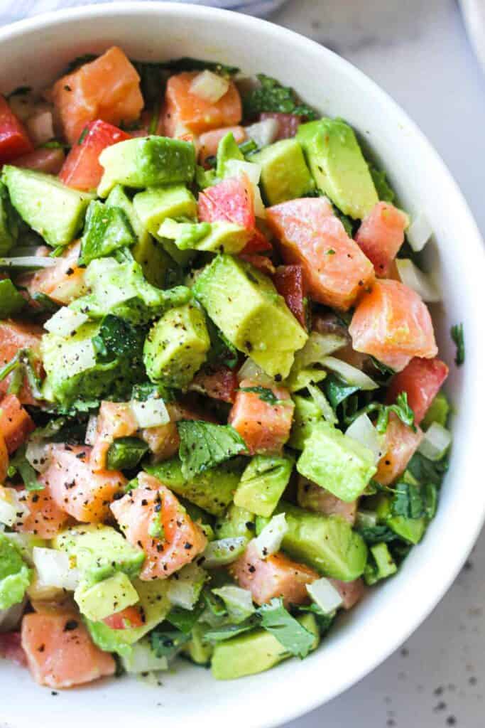 close look at fresh fish ceviche with avocado