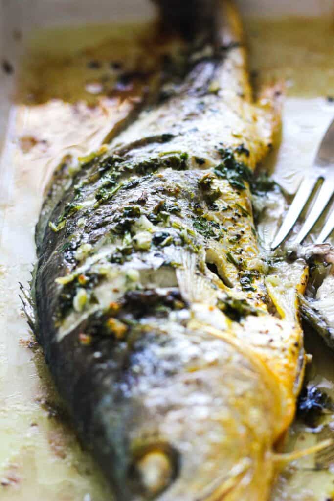 whole broiled yellow croaker with head on just out of the oven