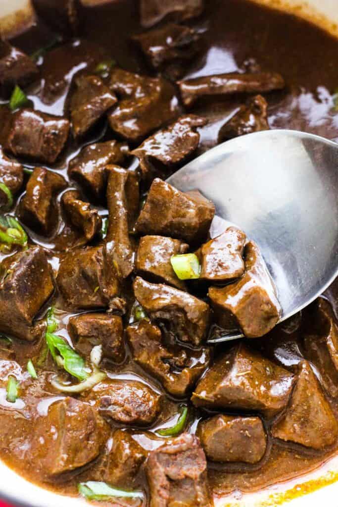 lamb heart stew with gravy and chopped green onions