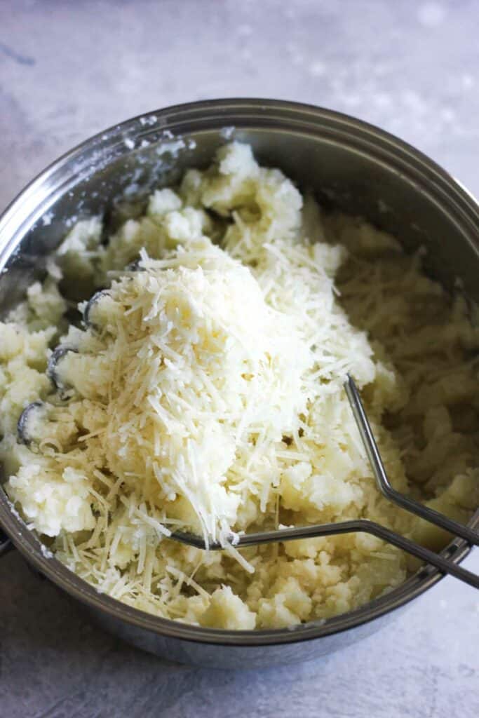 parmesan cheese on top of potatoes