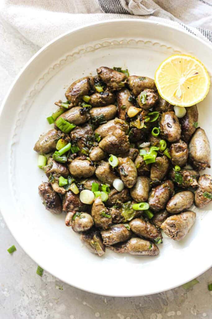 pan fried chicken hearts with chopped green onions
