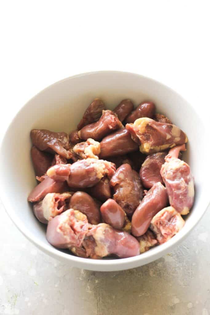 raw thawed chicken hearts before cooking