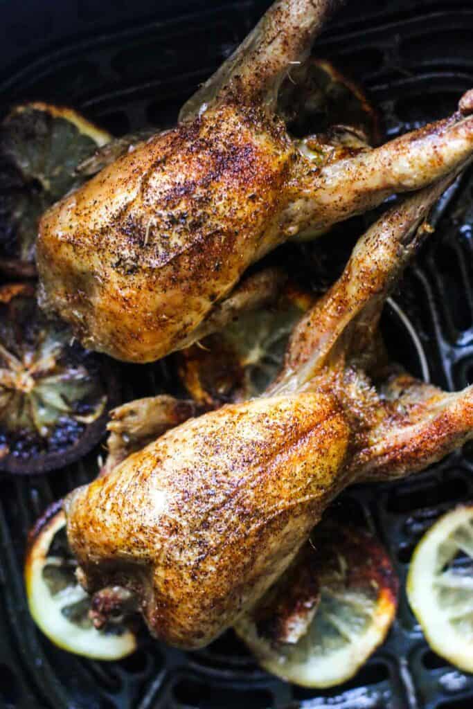 cooked browned poultry in the air fryer basket