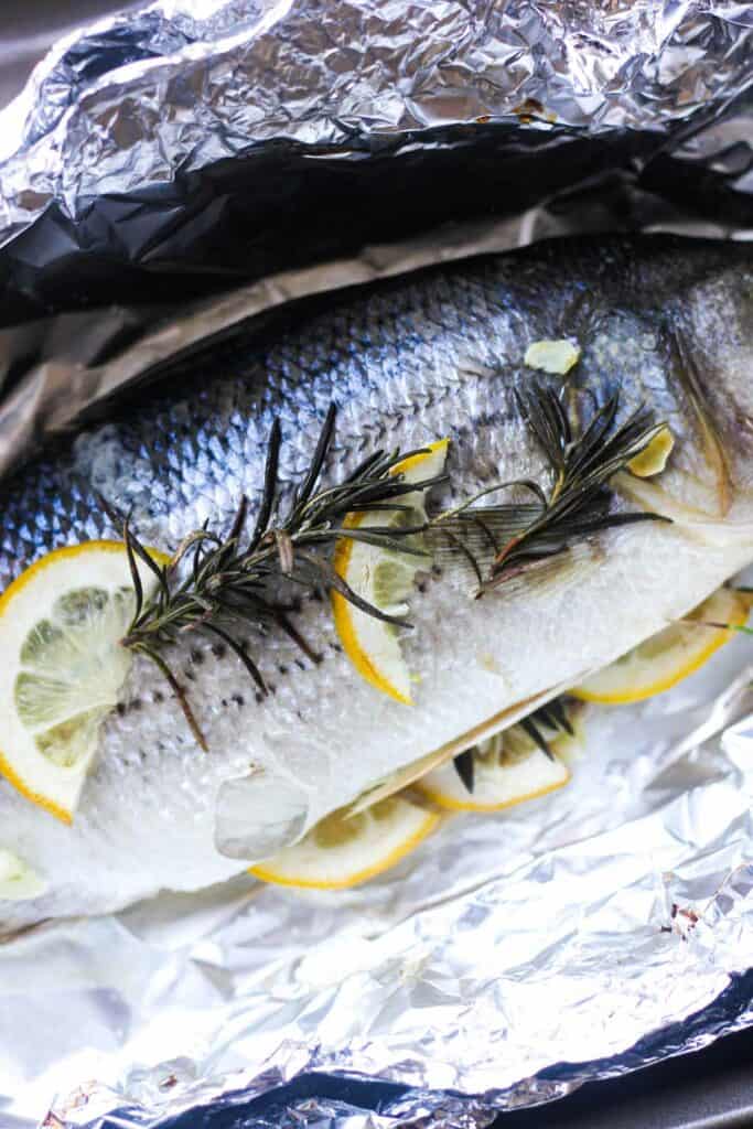 cooked seabass with lemon in foil