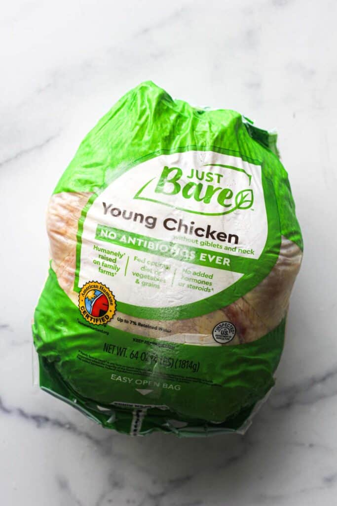 raw frozen whole chicken in the plastic package