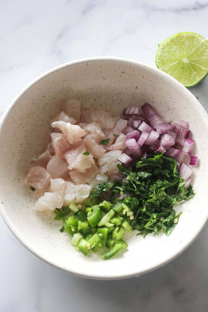 ingredients for fluke ceviche in the bowl before mixing