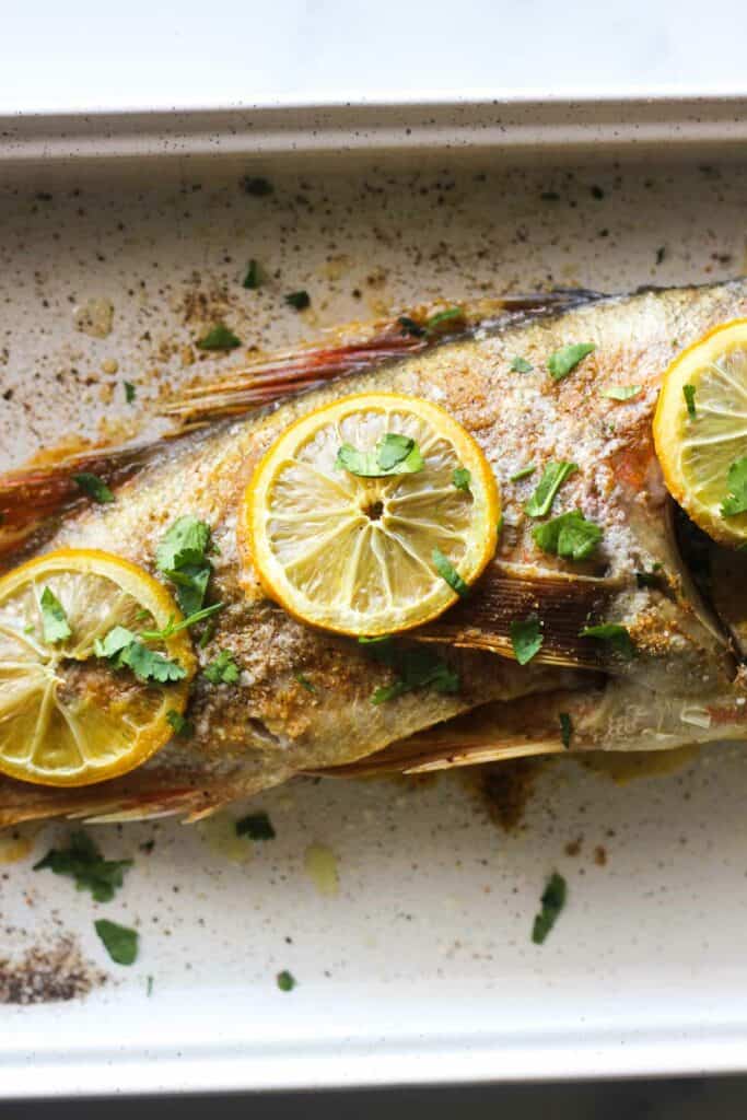 oven baked whole fish with lemon and seasoning