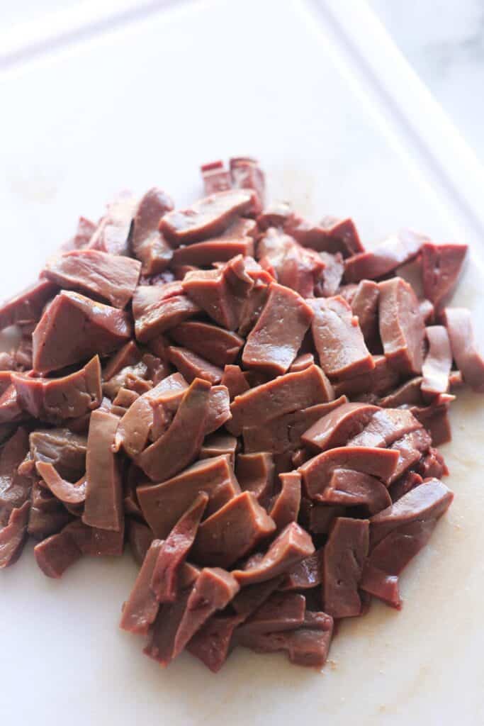 chopped raw liver on the white cutting board