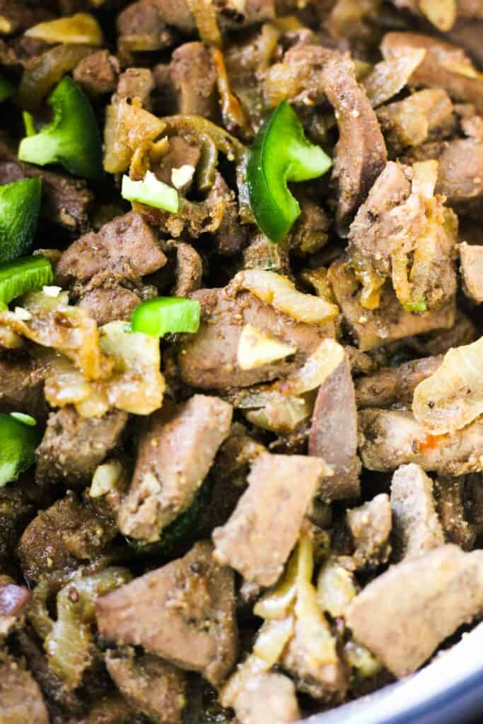 cooked Lebanese meat dish with jalapenos and onions
