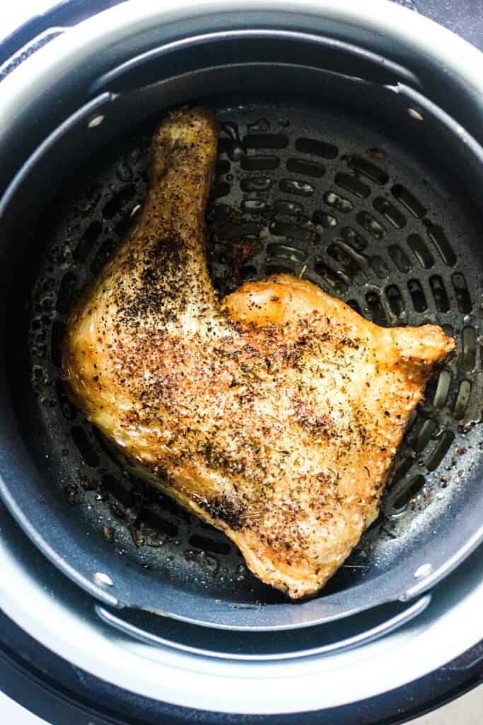 cooked poultry in the black air fryer basket