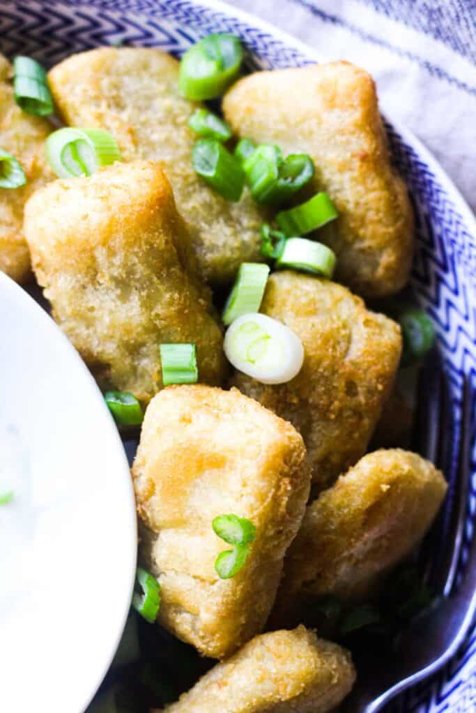 fish pieces topped with chopped green onions
