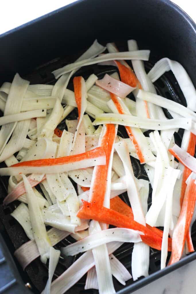 uncooked shredded crab sticks in the air fryer basket