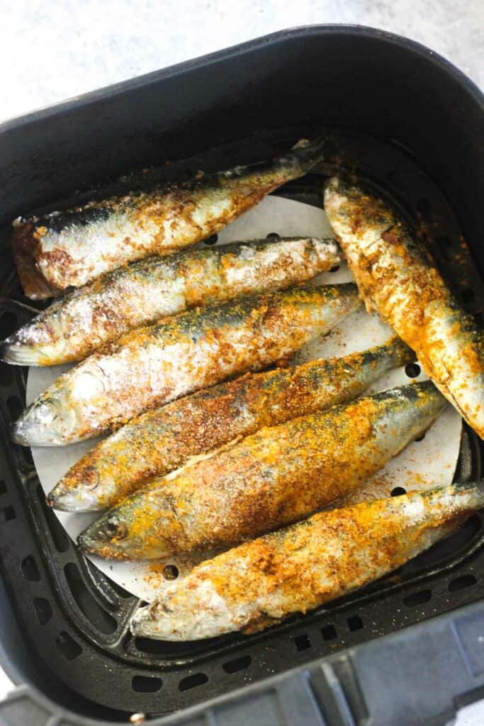 seasoned breaded sardines before cooking