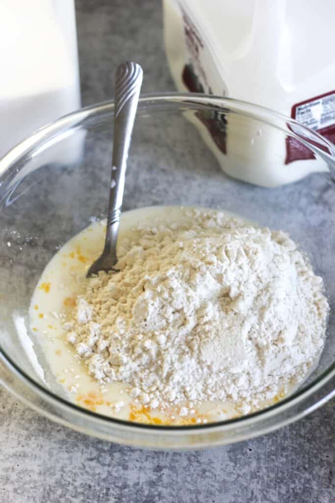 eggs, milk, sugar and flour mixing in to a batter