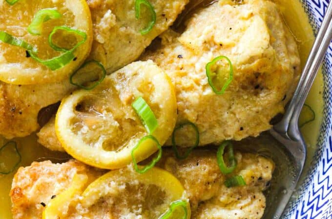 crockpot chicken breast with lemon and chopped green onions on top