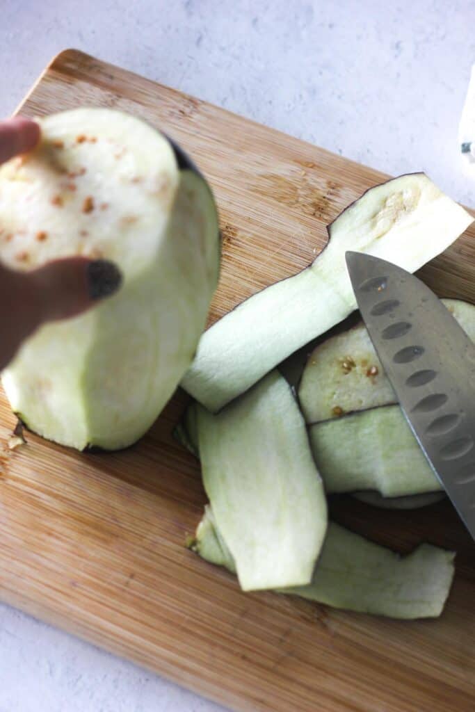 peeling eggplant with the knife