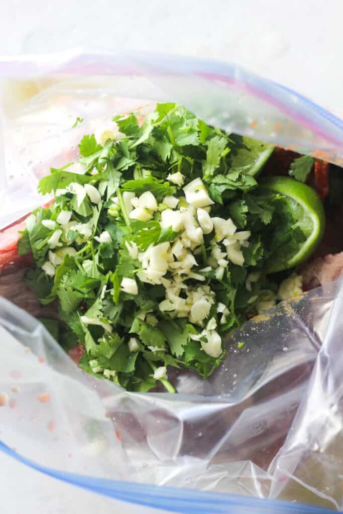 marinade in the zip lock bag with cilantro, lime , oil and spices