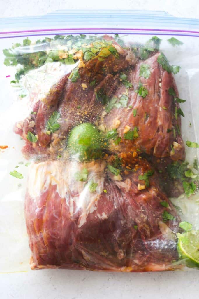 skirt steak with marinade in a zip lock bag