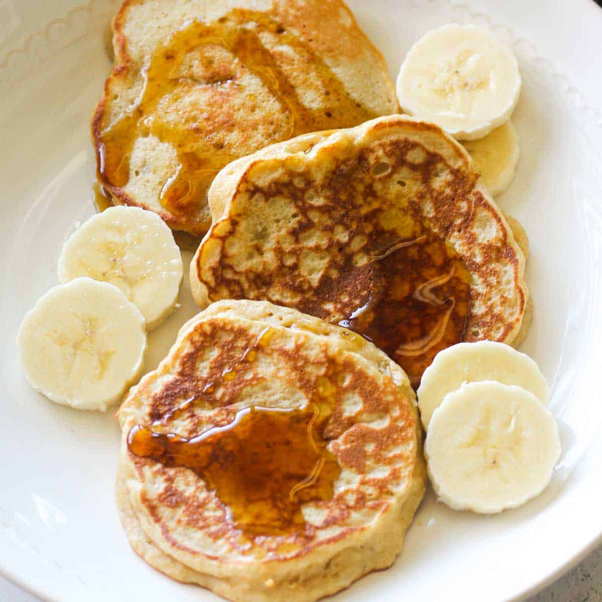 kodiak cakes banana pancakes with maple and bananas
