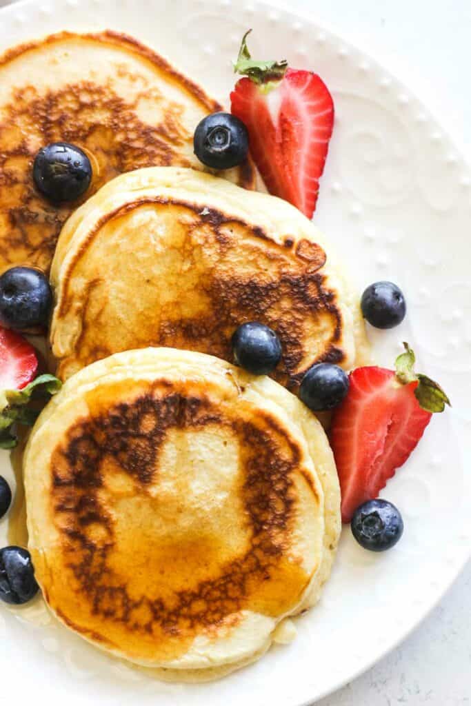 close view of evaporated milk pancakes with berries
