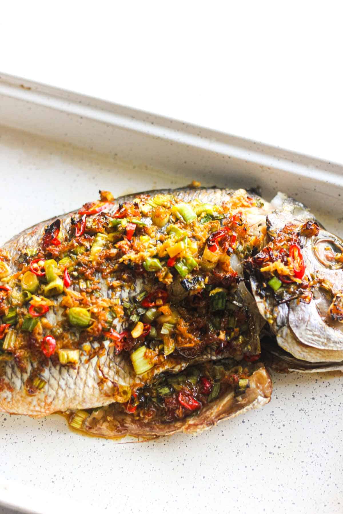 whole baked porgy in the baking dish