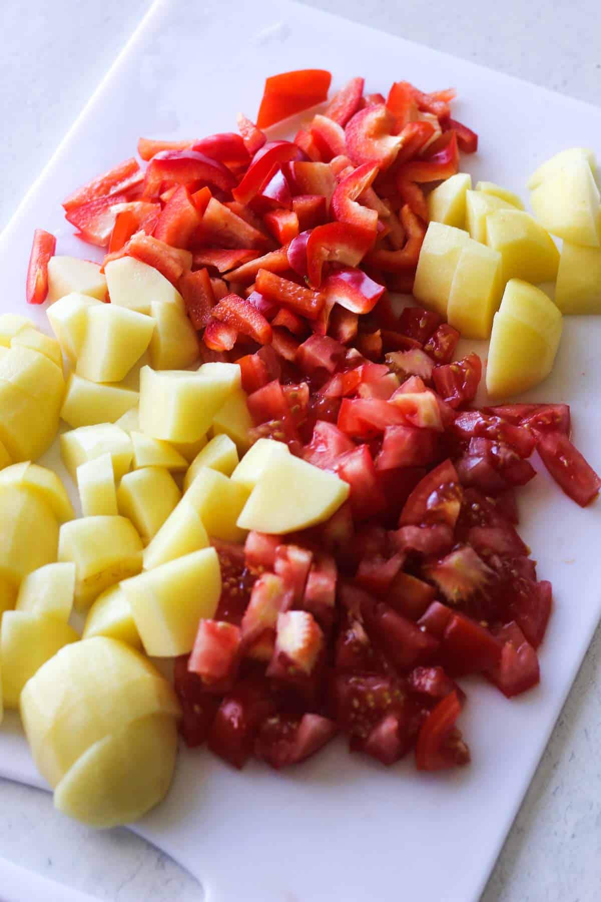 sliced bell peppers, tomatoes and cubed potatoes