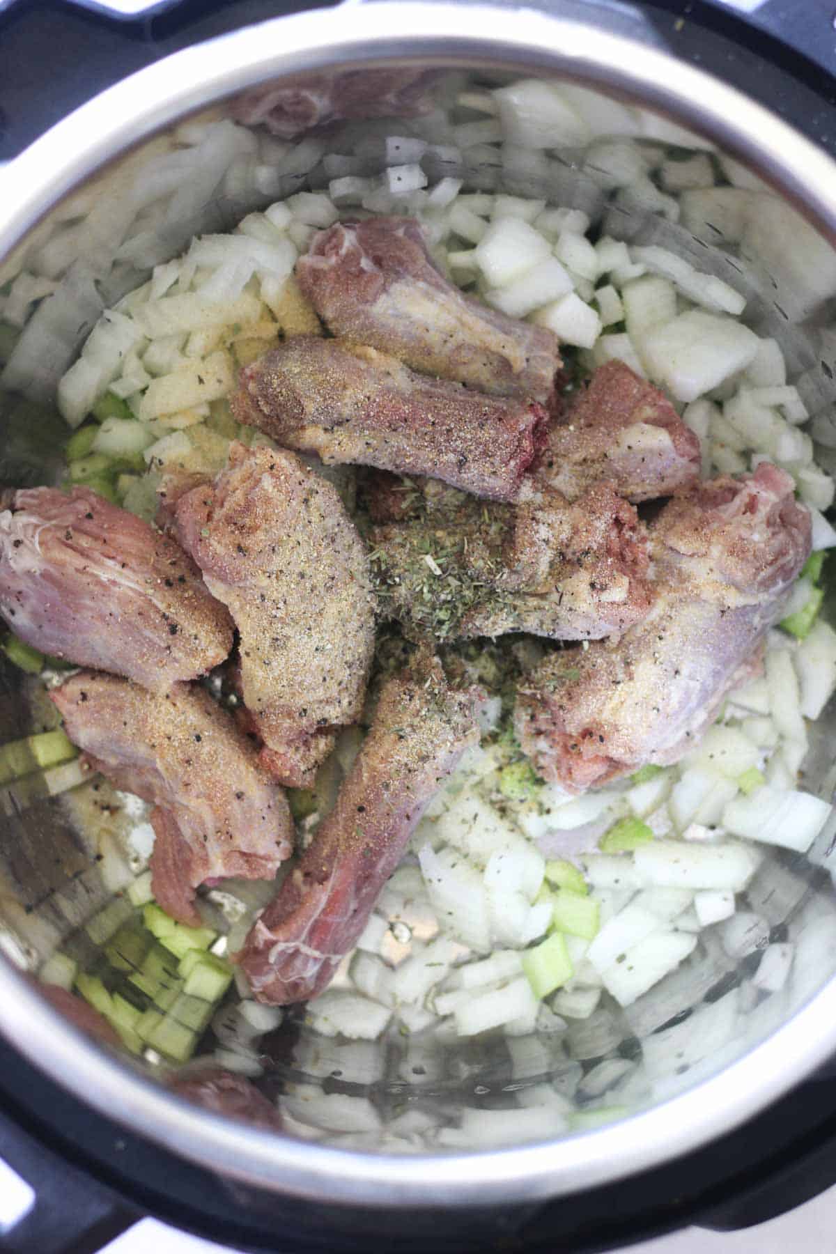chopped turkey neck in the pressure cooker with vegetables