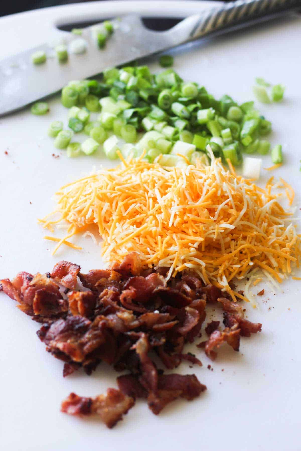 chopped green onions, bacon and shredded cheese