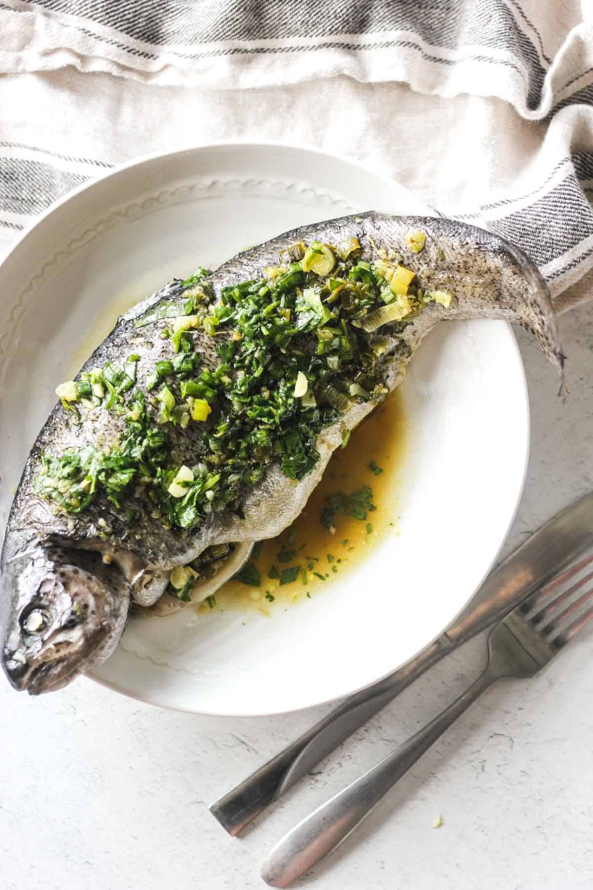 steamed trout on the plate