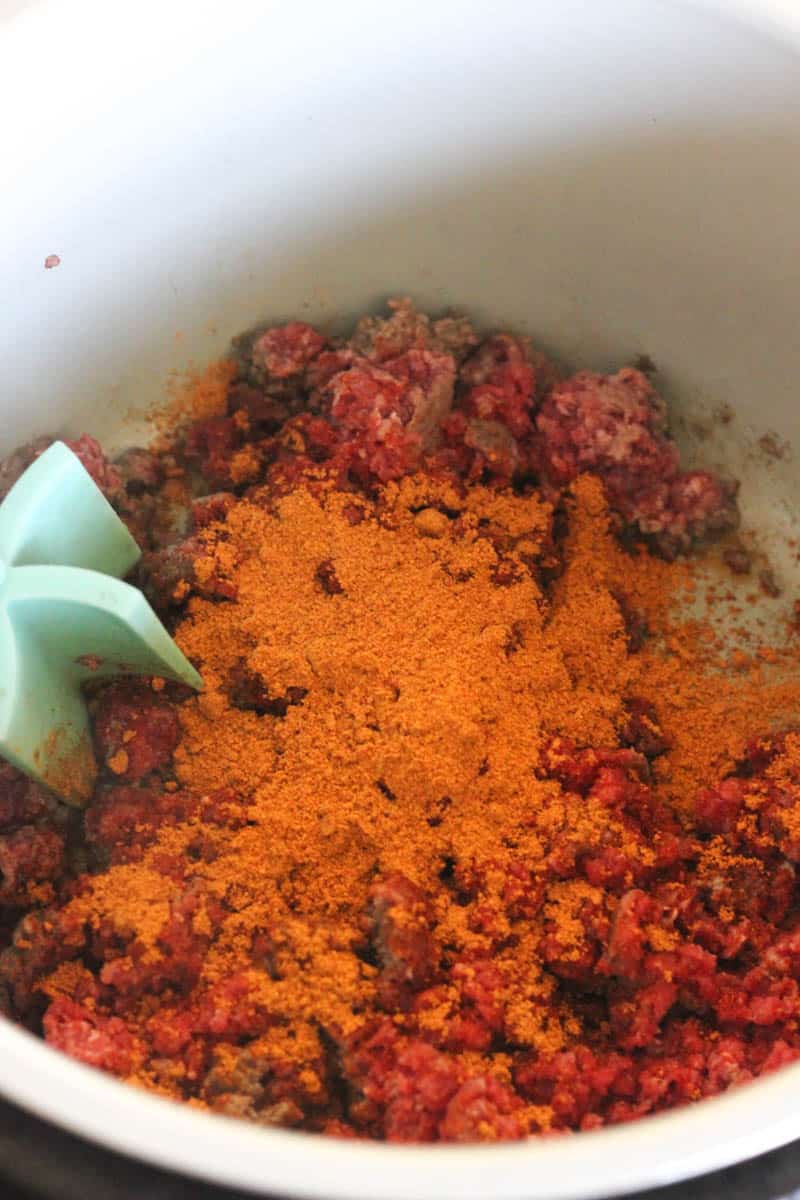 ground meat with spices in pressure cooker